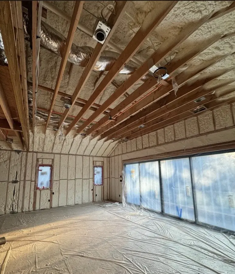 Interior walls and ceiling insulated with spray foam during new construction in Laramie